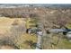 An aerial view of the house shows the spacious yard and surrounding trees at 4709 S County Road 500 E, Plainfield, IN 46168