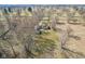 Aerial shot of a house showcasing the large backyard, mature trees, and inviting outdoor space at 4709 S County Road 500 E, Plainfield, IN 46168