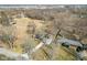 An aerial view of the house shows the spacious yard and surrounding trees at 4709 S County Road 500 E, Plainfield, IN 46168