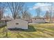 A view of the house shows the backyard, including the garage and drive at 4709 S County Road 500 E, Plainfield, IN 46168