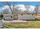 The backyard of the house features a grassy lawn, and detached two-car garage at 4709 S County Road 500 E, Plainfield, IN 46168