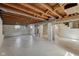 Basement features an exposed ceiling and painted floors at 4709 S County Road 500 E, Plainfield, IN 46168