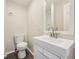Bathroom featuring wood-look floor, white walls, and a vanity at 4709 S County Road 500 E, Plainfield, IN 46168