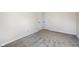 A bright bedroom features neutral paint and carpet, ready for personalization at 4709 S County Road 500 E, Plainfield, IN 46168