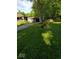 Well-manicured lawn with a house featuring a detached garage and ample green space for outdoor activities at 4709 S County Road 500 E, Plainfield, IN 46168