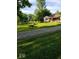 Charming single-story home with a well-maintained front yard, gravel driveway, and inviting curb appeal at 4709 S County Road 500 E, Plainfield, IN 46168