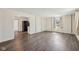 Spacious living room showcasing hardwood flooring, neutral wall colors, and a bright window at 4709 S County Road 500 E, Plainfield, IN 46168
