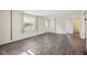Inviting living room with hardwood flooring, a bright window, and a doorway leading to other areas of the home at 4709 S County Road 500 E, Plainfield, IN 46168