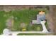 An aerial view displays the home, complemented by a spacious backyard with manicured landscaping and vibrant foliage at 4965 N 500 W, Columbus, IN 47201