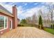 Expansive wooden deck, perfect for outdoor entertaining and relaxation with views of the well-manicured lawn at 4965 N 500 W, Columbus, IN 47201