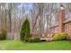 A cozy deck surrounded by mature trees and beautiful landscaping, offering a private outdoor retreat at 4965 N 500 W, Columbus, IN 47201