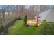 Aerial view of backyard featuring a wooden deck, manicured landscaping, and privacy fencing at 4965 N 500 W, Columbus, IN 47201
