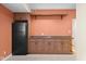 Finished basement bar area with wood cabinets, sink, shelving and space for a mini fridge at 4965 N 500 W, Columbus, IN 47201