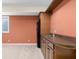 Finished basement bar area with wood cabinets, sink, shelving, window and space for a mini fridge at 4965 N 500 W, Columbus, IN 47201