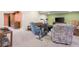 Carpeted basement with kitchenette, TV, and seating at 4965 N 500 W, Columbus, IN 47201