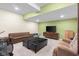 A spacious basement, with a TV and seating at 4965 N 500 W, Columbus, IN 47201