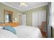 Cozy bedroom features a ceiling fan, closet, and a rocking chair for a peaceful retreat at 4965 N 500 W, Columbus, IN 47201