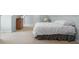 Spacious bedroom features neutral carpet, dresser, and white door, creating a serene retreat at 4965 N 500 W, Columbus, IN 47201