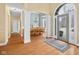 A bright foyer showcases an open floor plan, hardwood floors, and views into the dining room and front yard at 4965 N 500 W, Columbus, IN 47201