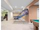 Finished basement game room featuring a basketball hoop game, and neutral carpeting at 4965 N 500 W, Columbus, IN 47201