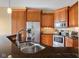 Gourmet kitchen features stainless steel appliances, custom cabinets, and granite countertops, perfect for culinary enthusiasts at 4965 N 500 W, Columbus, IN 47201