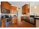 Stylish kitchen features stainless steel appliances, custom cabinets, and a seamless transition to the adjacent dining area at 4965 N 500 W, Columbus, IN 47201