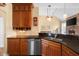 Well-equipped kitchen with stainless steel appliances, custom cabinetry, and dark countertops, perfect for cooking and entertaining at 4965 N 500 W, Columbus, IN 47201