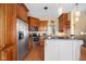 Open kitchen design with stainless steel appliances, custom cabinetry, and an island with bar seating, ideal for entertaining at 4965 N 500 W, Columbus, IN 47201