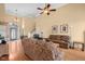 Spacious living room showcasing hardwood floors, comfortable seating, and a welcoming atmosphere for gatherings at 4965 N 500 W, Columbus, IN 47201