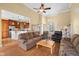 Open-concept living room with high ceilings, hardwood floors, and seamless flow to the kitchen and dining area at 4965 N 500 W, Columbus, IN 47201