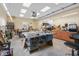 A spacious workshop featuring an array of professional woodworking equipment and ample natural light from multiple windows at 4965 N 500 W, Columbus, IN 47201