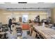 Well-lit workshop offering an array of tools and equipment, complemented by natural light streaming through the windows at 4965 N 500 W, Columbus, IN 47201