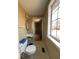 Small powder room with a single sink and window providing natural light at 5155 Overland Ct, Indianapolis, IN 46268
