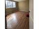 Bedroom with wood floor, neutral walls and a window providing natural light at 5155 Overland Ct, Indianapolis, IN 46268