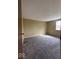 Carpeted bedroom with neutral tan walls and a window at 5155 Overland Ct, Indianapolis, IN 46268