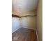 Walk in closet with wood floor, overhead light fixture, and closet shelf at 5155 Overland Ct, Indianapolis, IN 46268