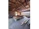 Spacious garage with exposed wood rafters, work bench, and room for storage and projects at 5155 Overland Ct, Indianapolis, IN 46268