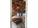 Spacious garage with exposed wood framing and door, providing ample space for vehicles and storage at 5155 Overland Ct, Indianapolis, IN 46268