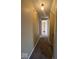 Hallway with overhead lighting and carpet. The hall is tan painted with white trim at 5155 Overland Ct, Indianapolis, IN 46268
