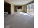 Open living room featuring a sliding glass door to the outdoor deck, providing natural light at 5155 Overland Ct, Indianapolis, IN 46268