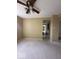 Standard living room featuring neutral walls, carpet and a ceiling fan with overhead lighting at 5155 Overland Ct, Indianapolis, IN 46268