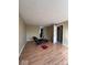 This open living room has hardwood floors and features a door to the adjoining room at 5155 Overland Ct, Indianapolis, IN 46268