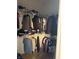 This walk-in closet offers plenty of storage space for clothing and accessories, making organization a breeze at 5832 Cabot Dr, Indianapolis, IN 46221