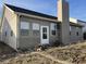 Exterior of the back of the home features siding, roof and backyard at 5832 Cabot Dr, Indianapolis, IN 46221