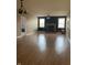 A spacious living room filled with natural light, beautiful hardwood floors, and a charming fireplace at 5832 Cabot Dr, Indianapolis, IN 46221