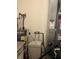 Utility room showcasing a water heater, water softener, and HVAC unit at 5832 Cabot Dr, Indianapolis, IN 46221