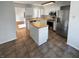 Bright, updated kitchen features stainless steel appliances, white cabinets, and a functional center island at 6232 Behner Xing, Indianapolis, IN 46250