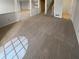 Large living room with plush carpet, open floor plan, and a view into the adjacent rooms at 6232 Behner Xing, Indianapolis, IN 46250