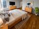 Comfortable main bedroom boasts hardwood floors, natural light, and stylish décor with neutral colors at 6232 Behner Xing, Indianapolis, IN 46250