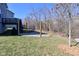 Backyard features stone fire pit and wooded area at 655 Bracknell Dr, Avon, IN 46123